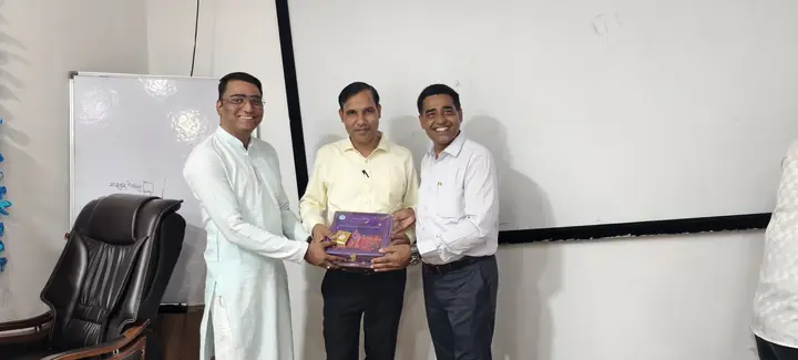 Felicitation ceremony at the office boardroom