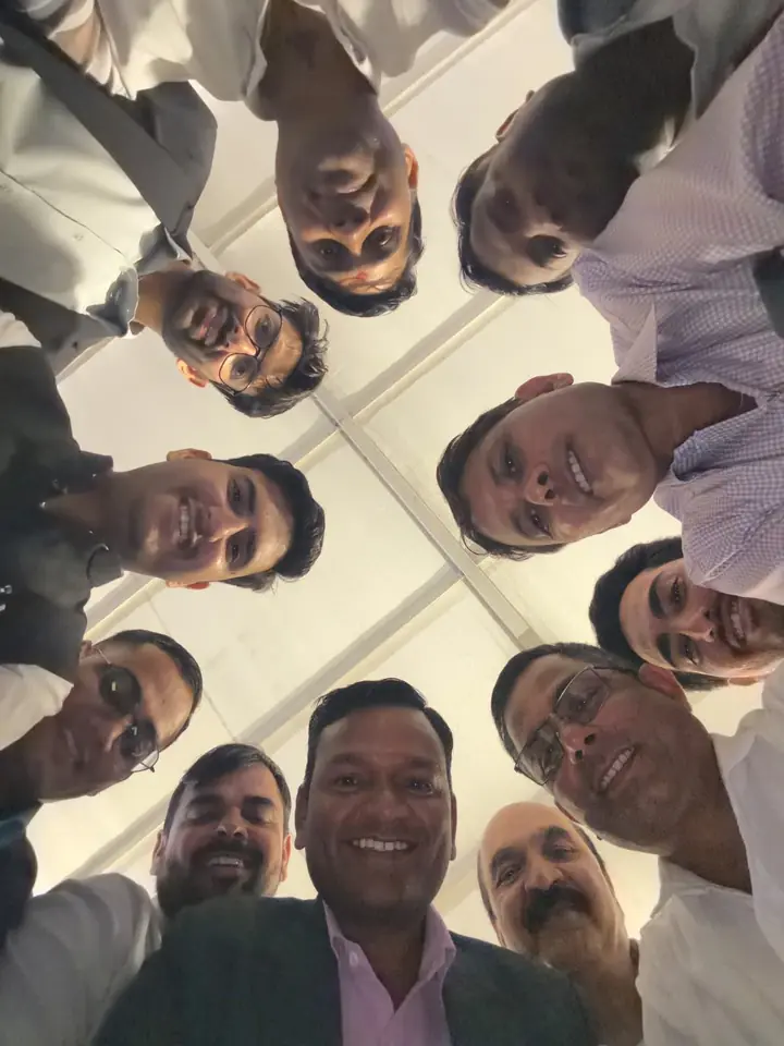 Team huddle celebrating a successful milestone